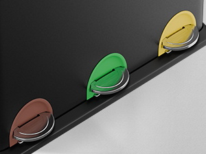 Support ou support mural noir avec trois composants en forme de larme dans les couleurs marron, vert et jaune