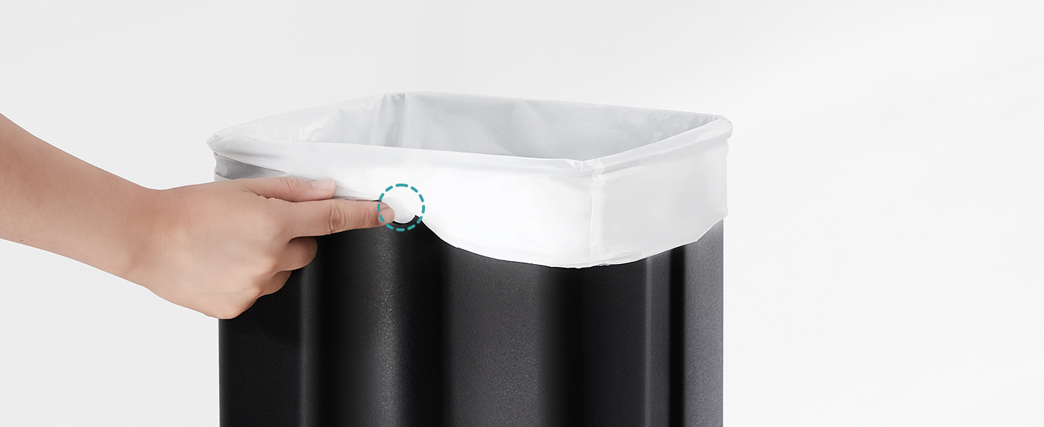 Close-up view of a cylindrical black container with white liner being adjusted, showing the top rim detail.